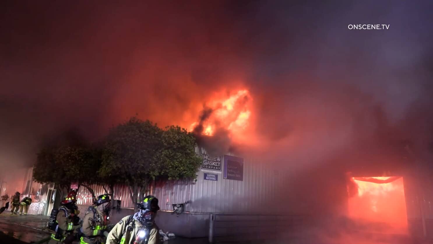 Western Hose and Gasket building is shown with fire billowing from the inside out, with their company sign dramatically engulfed.