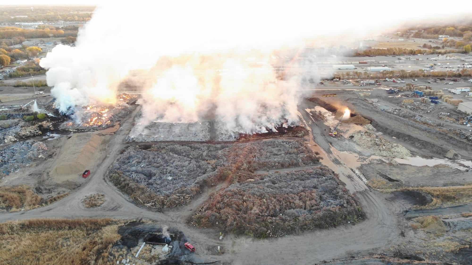 Smoke rises from the recycling center fire.