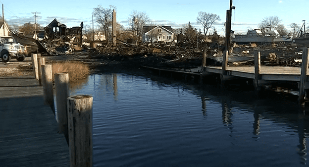 Damage to the marina warehouse reveals rubble the next day.
